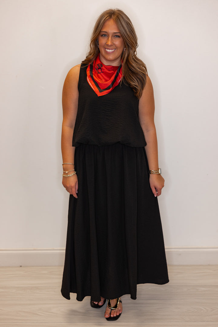 Women's black textured bubble hem sleeveless crop top by Entro showing full front view