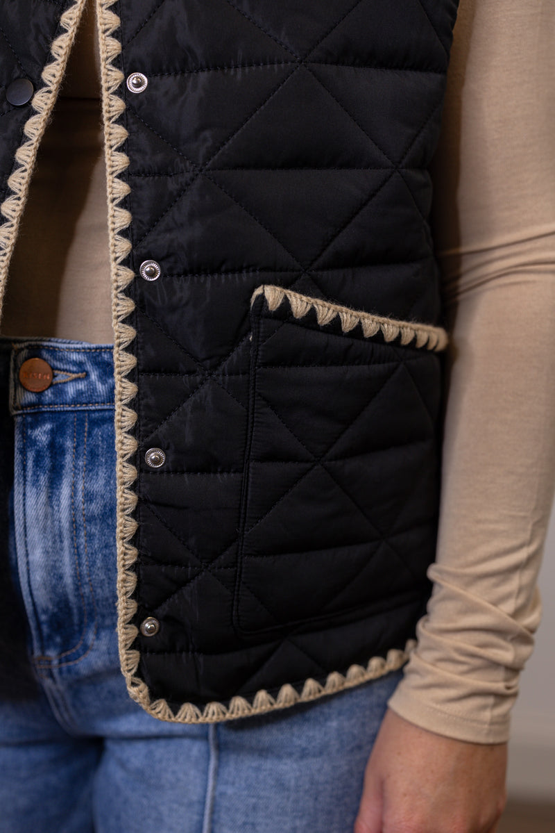 women's black quilted tan trim vest