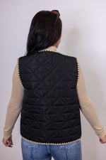 women's black quilted tan trim vest