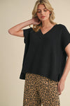 Jodifl Black ribbed boxy sweater with a v neckline and short dolman sleeves