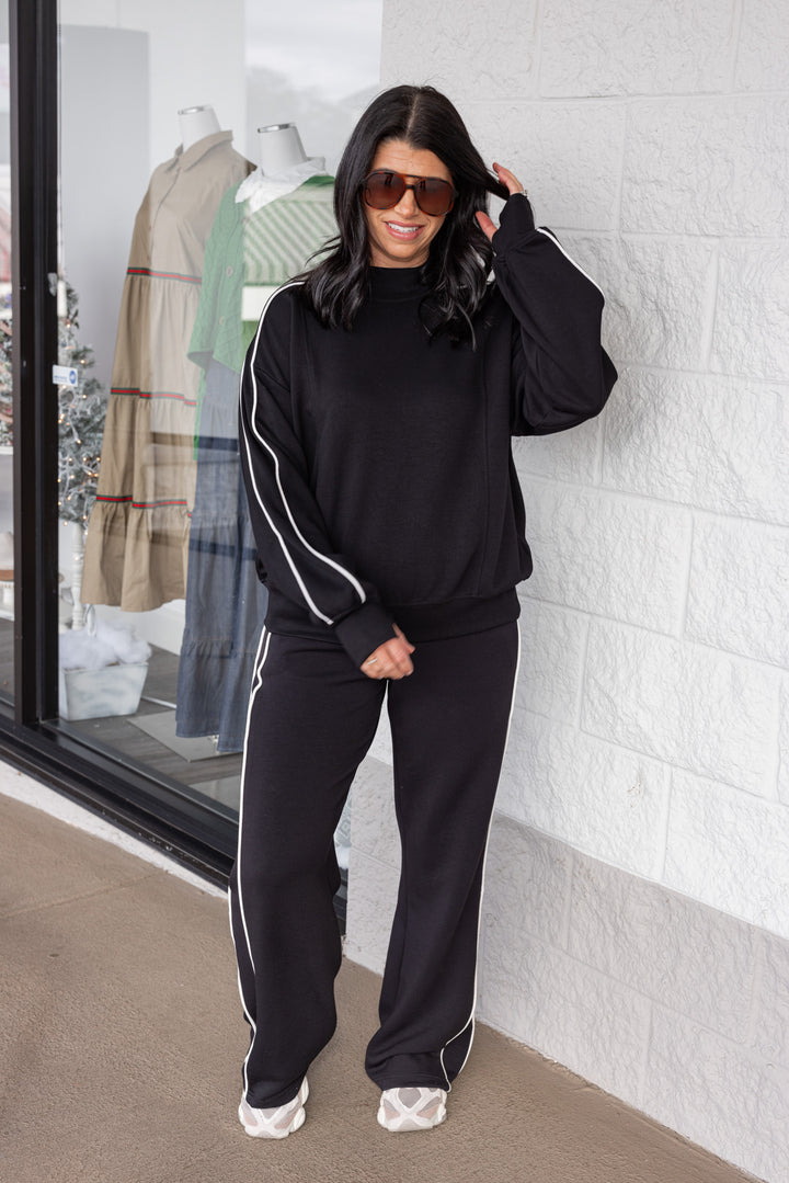 Women's black scuba knit straight leg elastic waist pants by Rae Mode, perfect for casual days