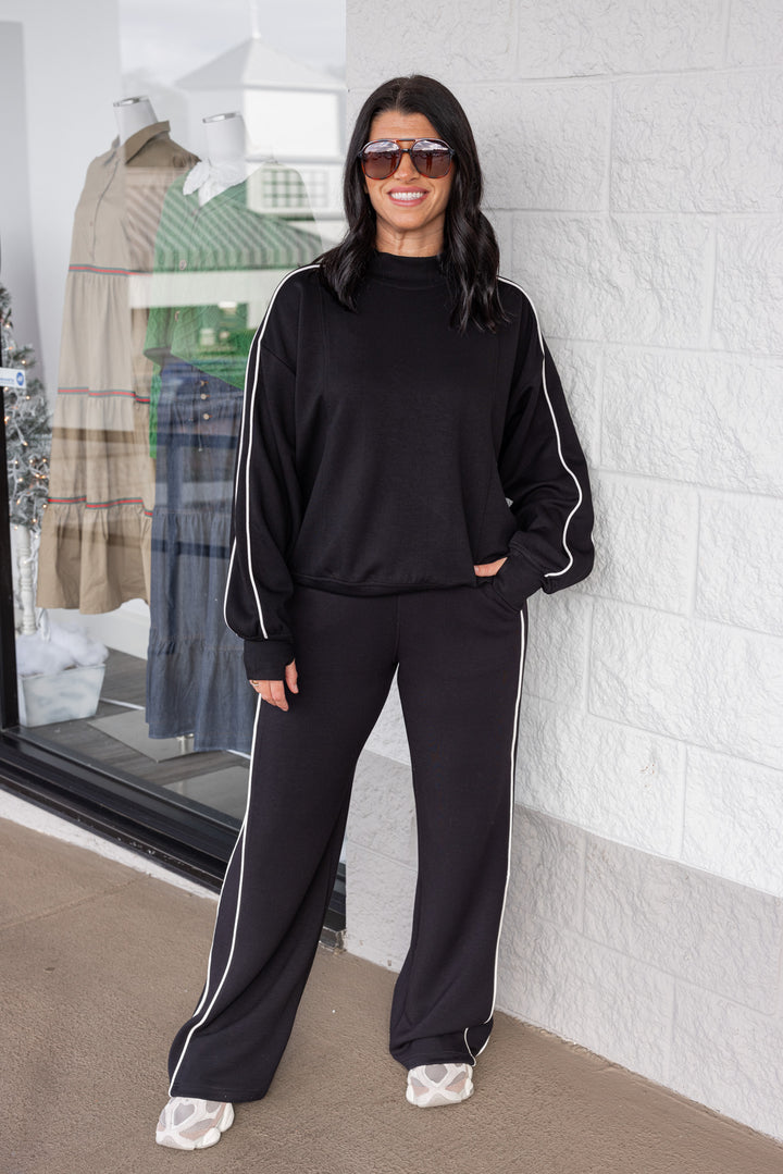 Women's black scuba knit straight leg elastic waist pants by Rae Mode shown with matching top