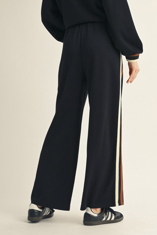 Women's black scuba knit pants with ribbed colorblock trim by Jodifl showing back view