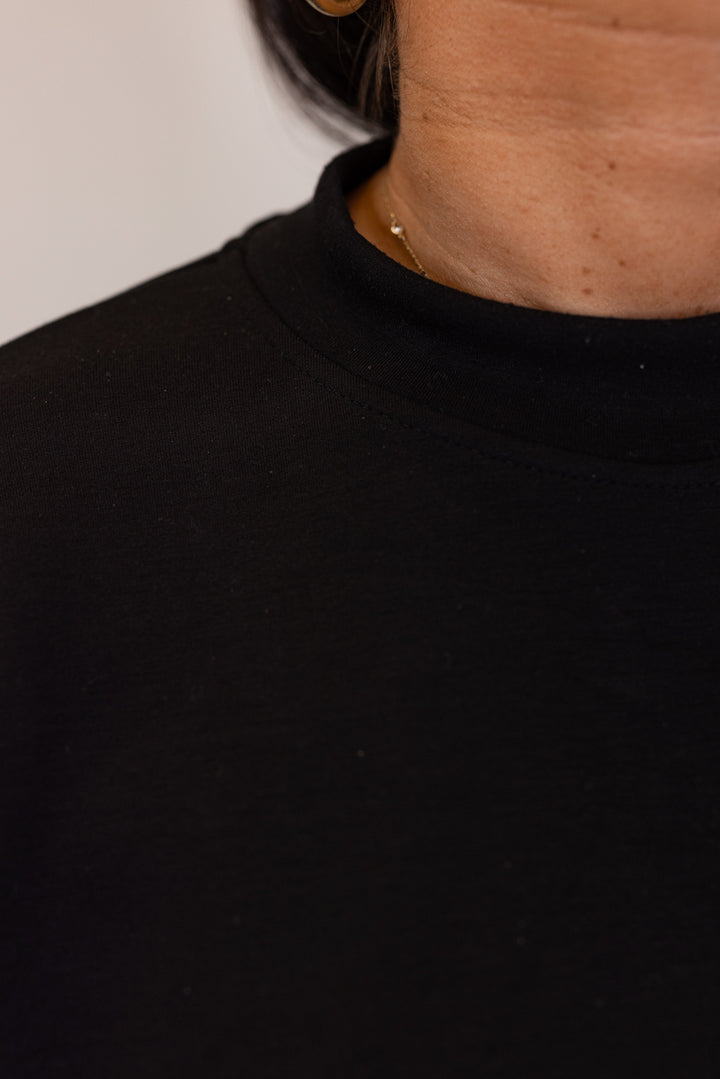 Black scuba knit pullover top by Rae Mode showing mock neckline