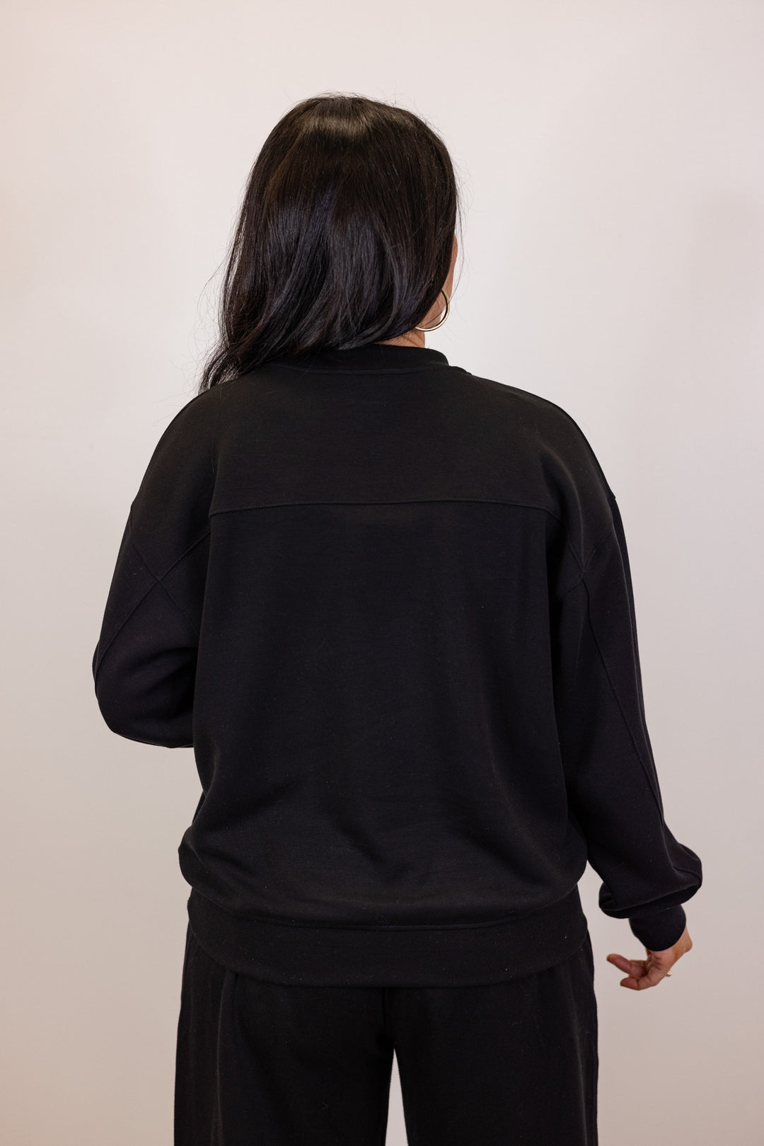 Black scuba knit mock neck pullover top by Rae Mode showing up close back view
