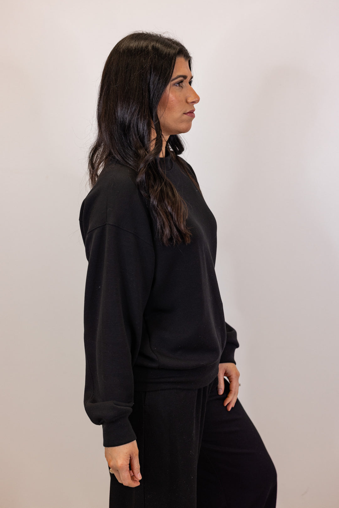 Black scuba knit mock neck pullover top by Rae Mode showing up close side view