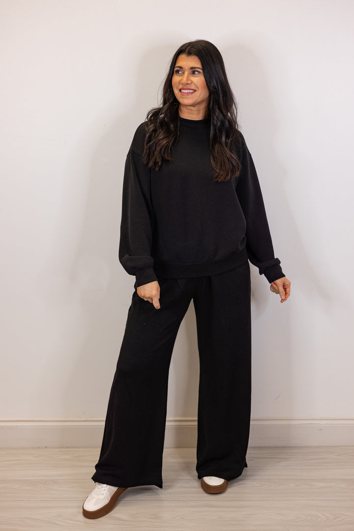 Black scuba knit mock neck pullover top by Rae Mode showing full front view