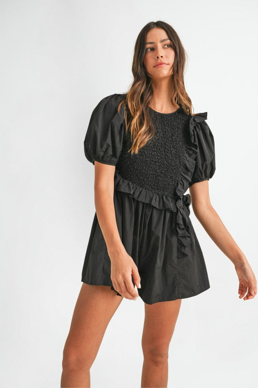 Mable Black smocked romper with ruffle trim