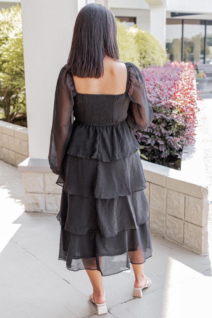 Women's black ruffle layer tiered midi dress with black shimmering details by Blu Pepper showing full back view
