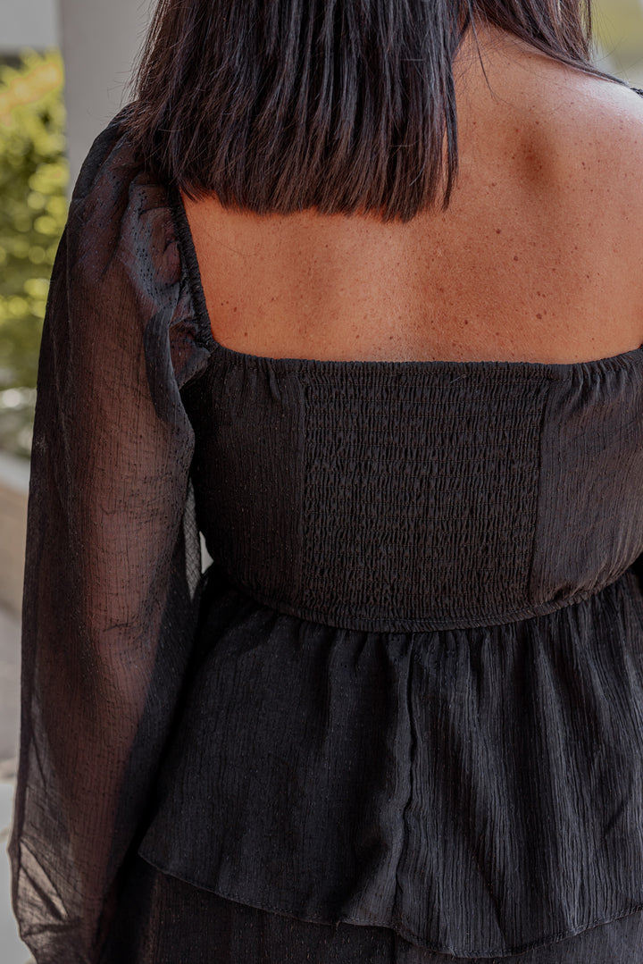 Women's black ruffle layer tiered midi dress with black shimmering details by Blu Pepper showing up close back view