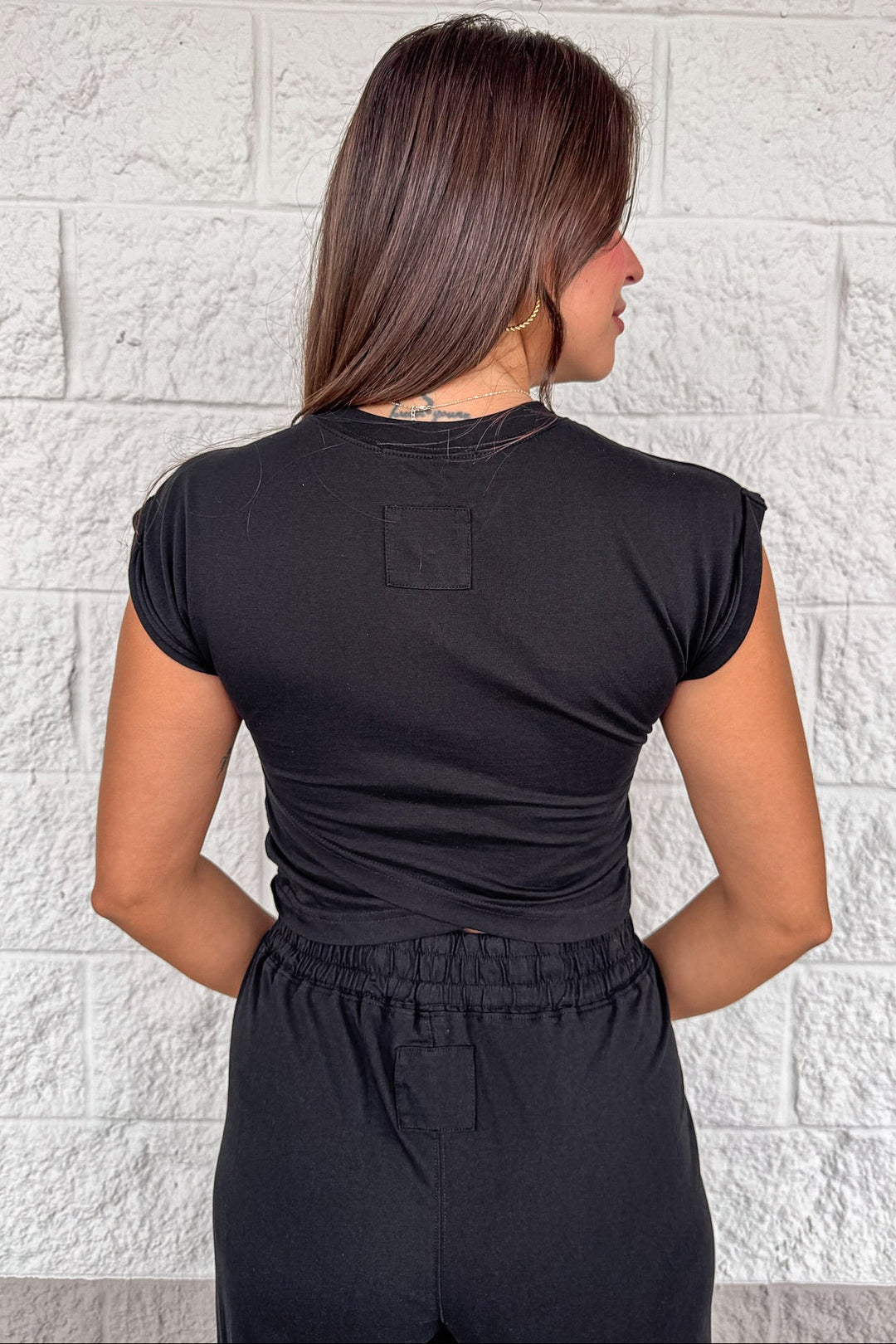 solid black sleeveless cropped top and jogger pants matching athleisure set