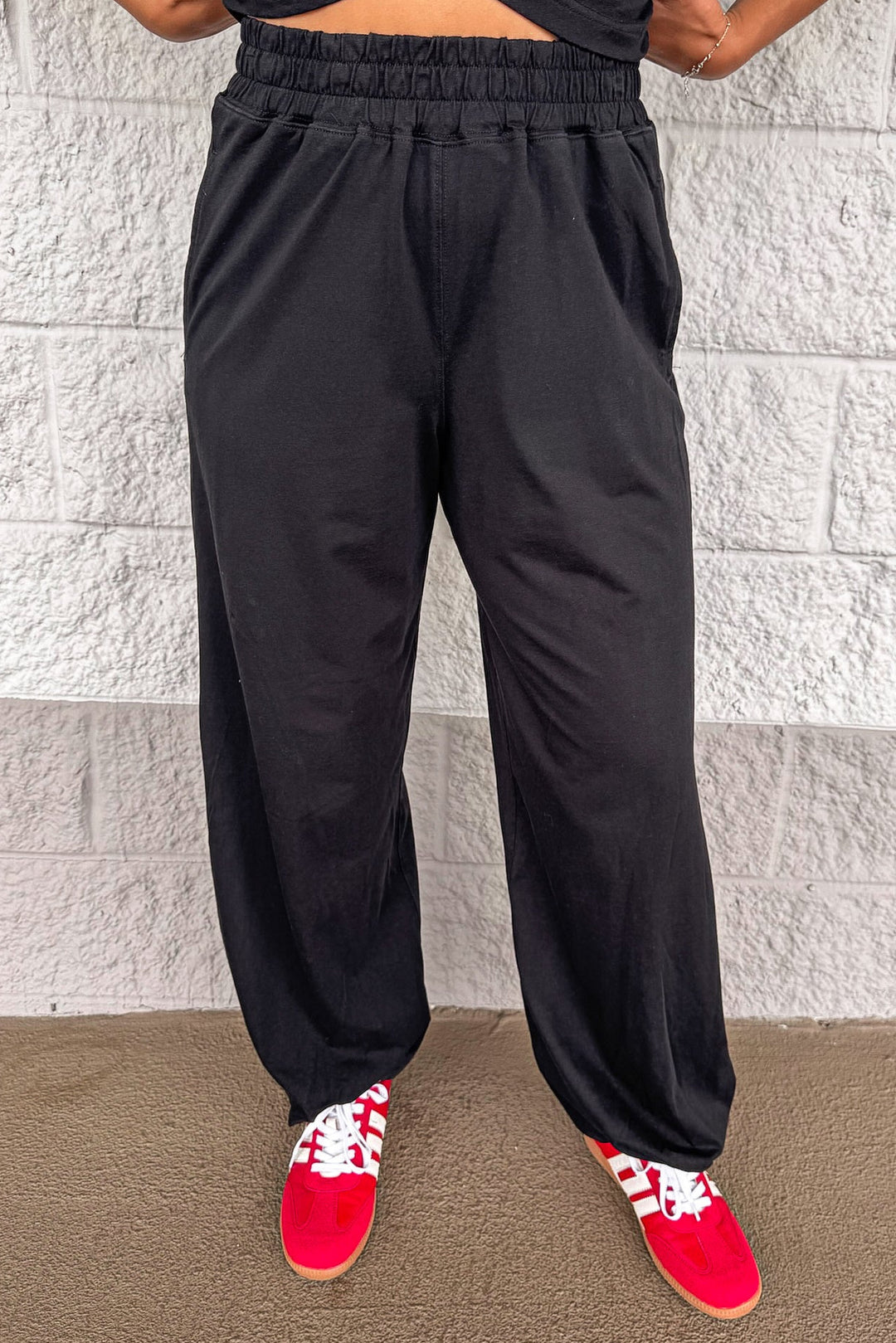 solid black sleeveless top and elastic waist jogger pants matching athleisure set