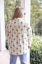 ivory black bow printed button down top