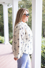 ivory black bow printed button down top