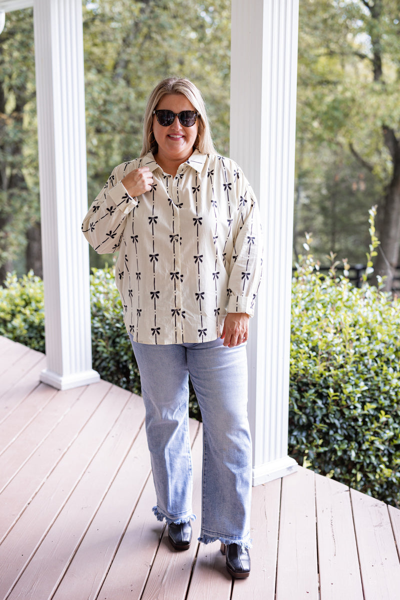 ivory black bow printed button down top