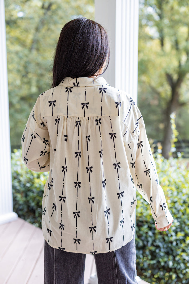 ivory black bow printed button down top