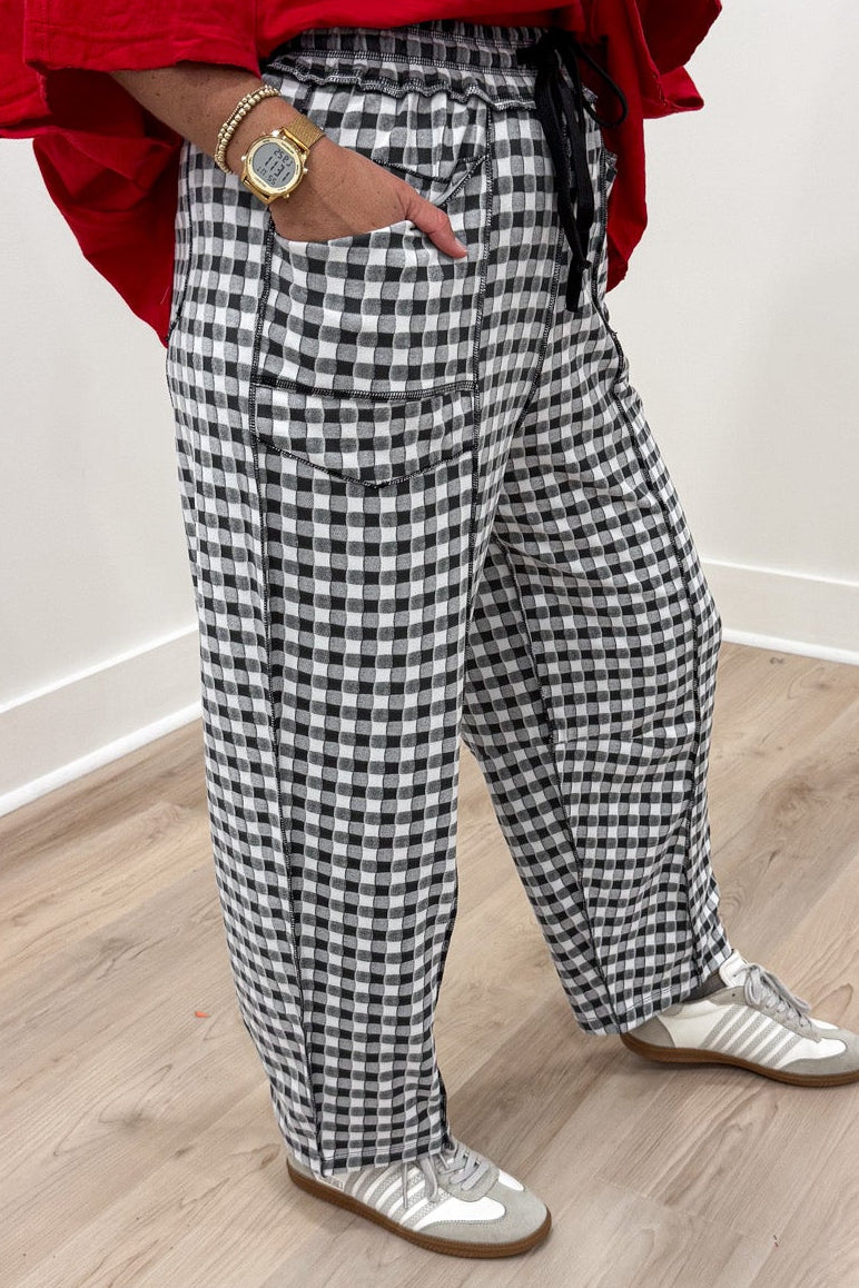 black and white gingham checkered print relaxed barrel leg soft knit pants with reverse seam details