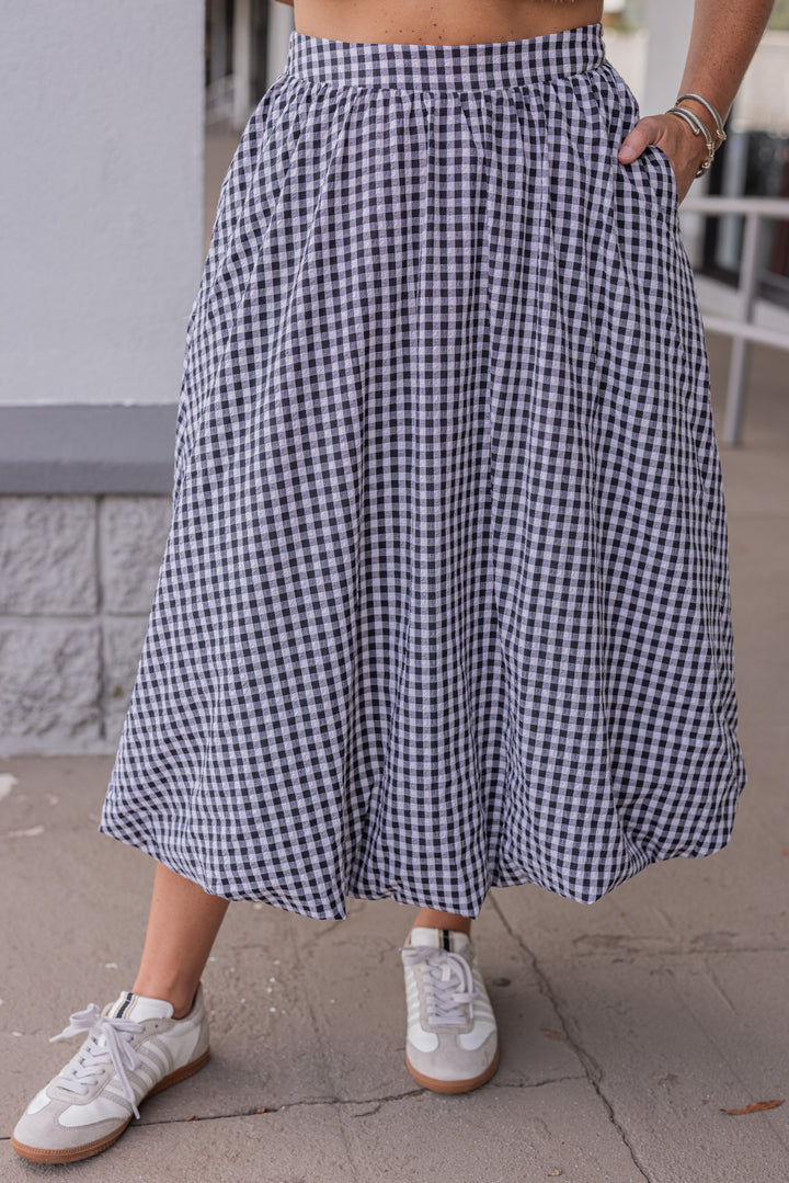 Women's black and white gingham textured midi skirt with bubble hem by Easel showing up close front view