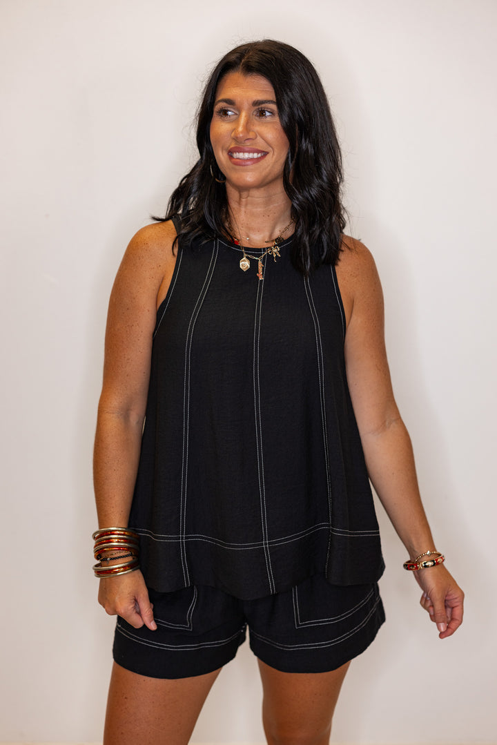 Black elastic waist shorts with white stitching by Entro showing up close front view