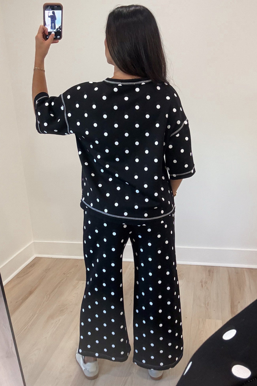 black with white polka dot print relaxed silhouette top and wide leg pants matching knit set