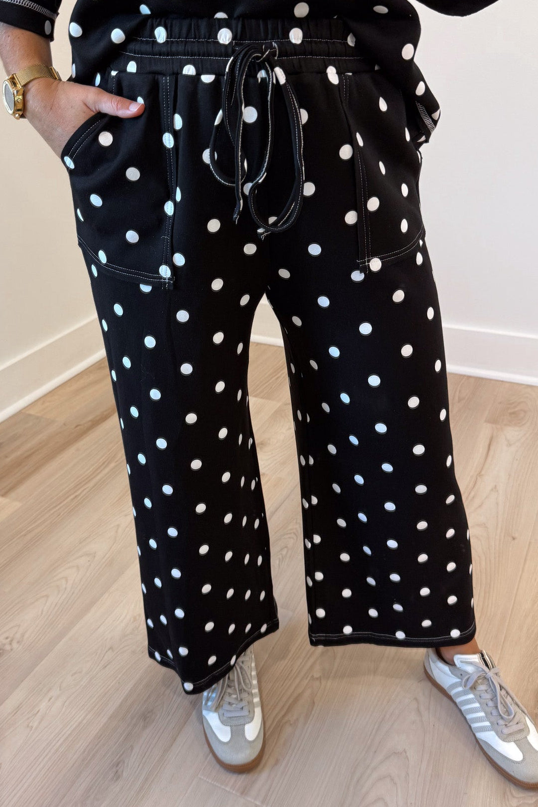 black with white polka dot print relaxed silhouette top and drawstring pants matching knit set