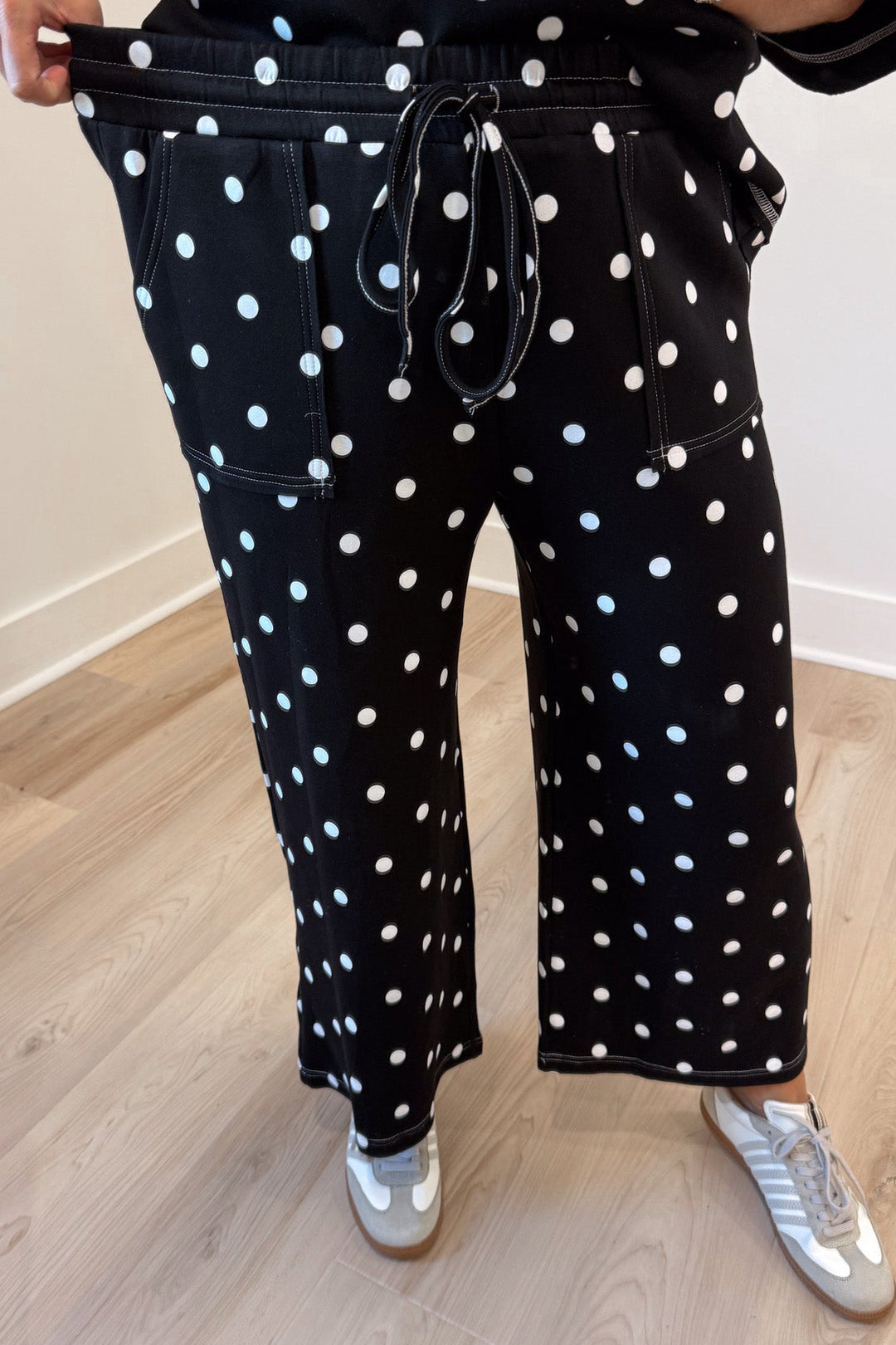 black with white polka dot print relaxed silhouette top and elastic waist pants matching knit set