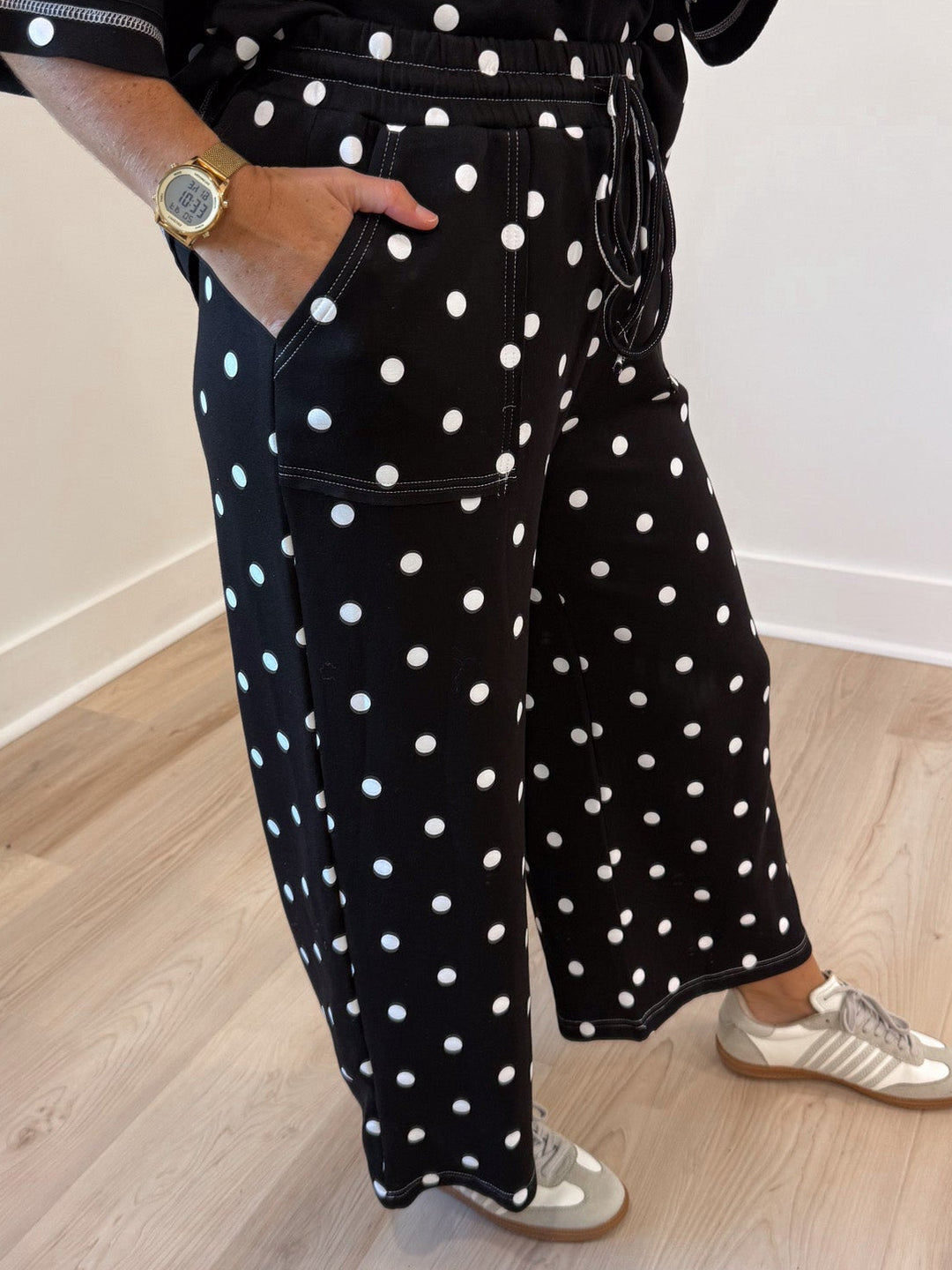 black with white polka dot print relaxed silhouette top and front patch pocket pants matching knit set