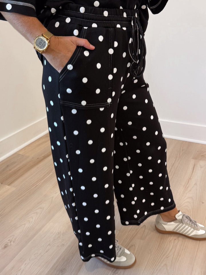 black with white polka dot print relaxed silhouette top and front patch pocket pants matching knit set