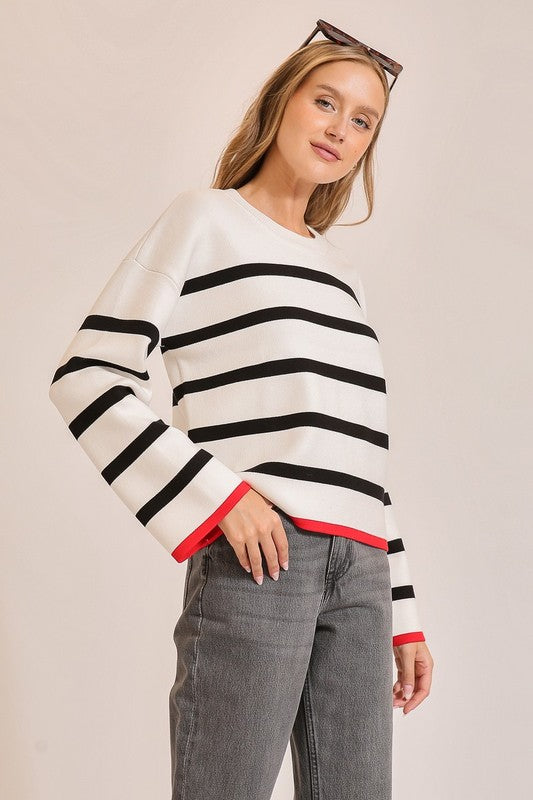 Lumiere White knit sweater with black stripes and red trim