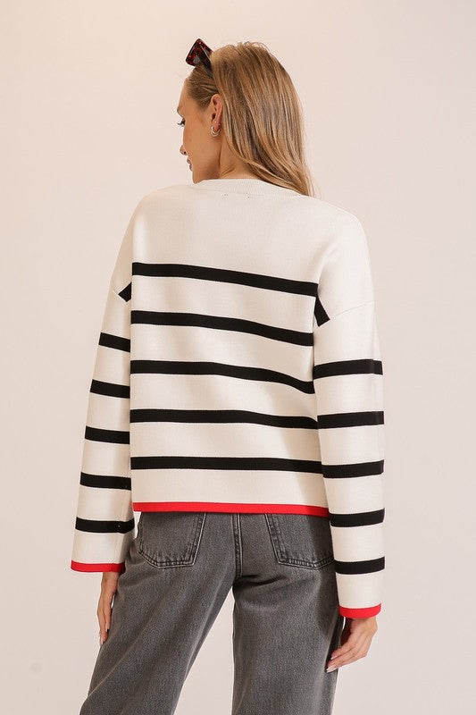 Lumiere White knit sweater with black stripes and red trim