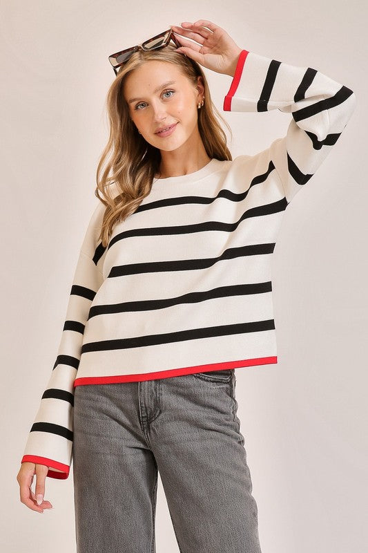 Lumiere White knit sweater with black stripes and red trim