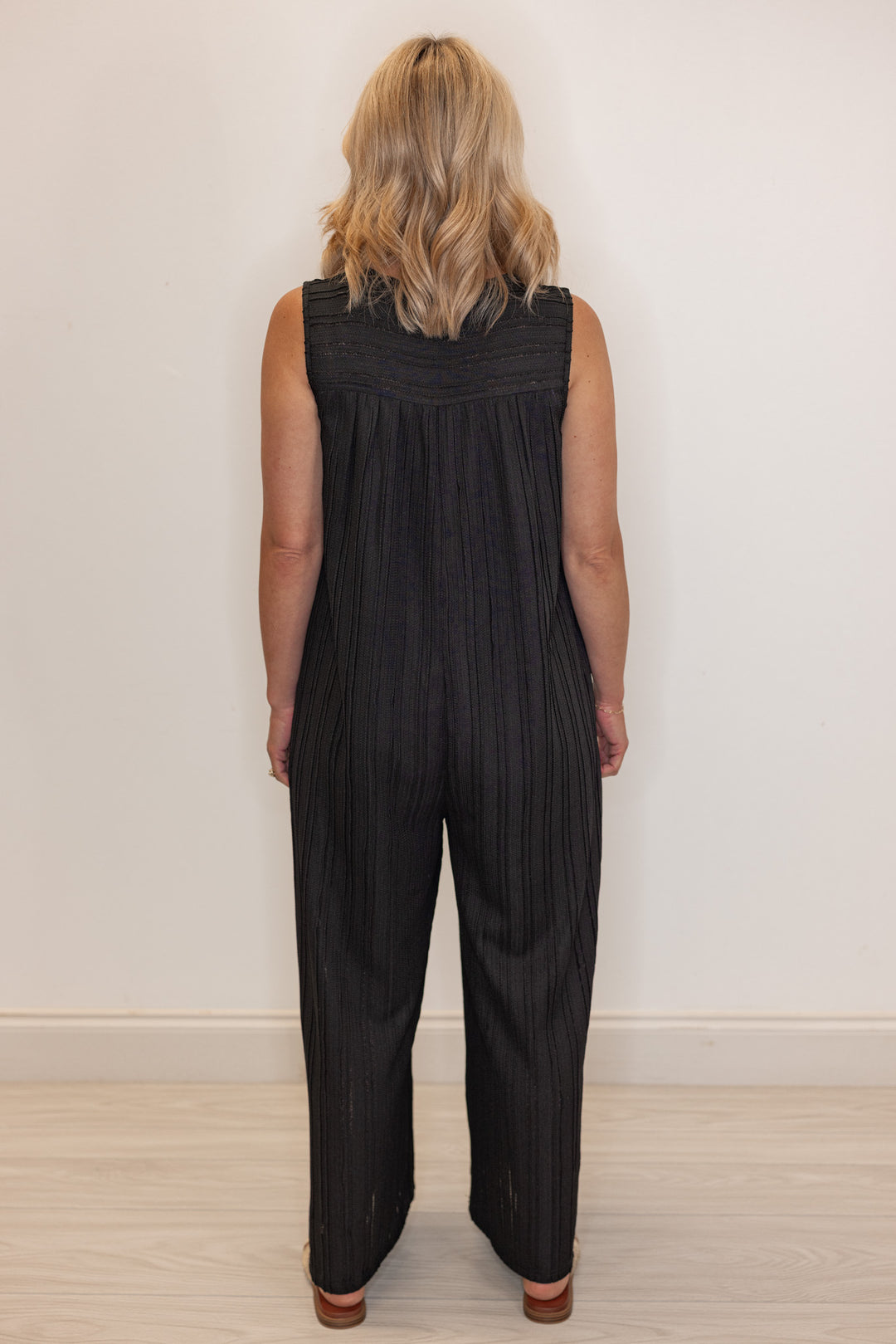 Women's black textured summer romper by Jodifl showing full back view