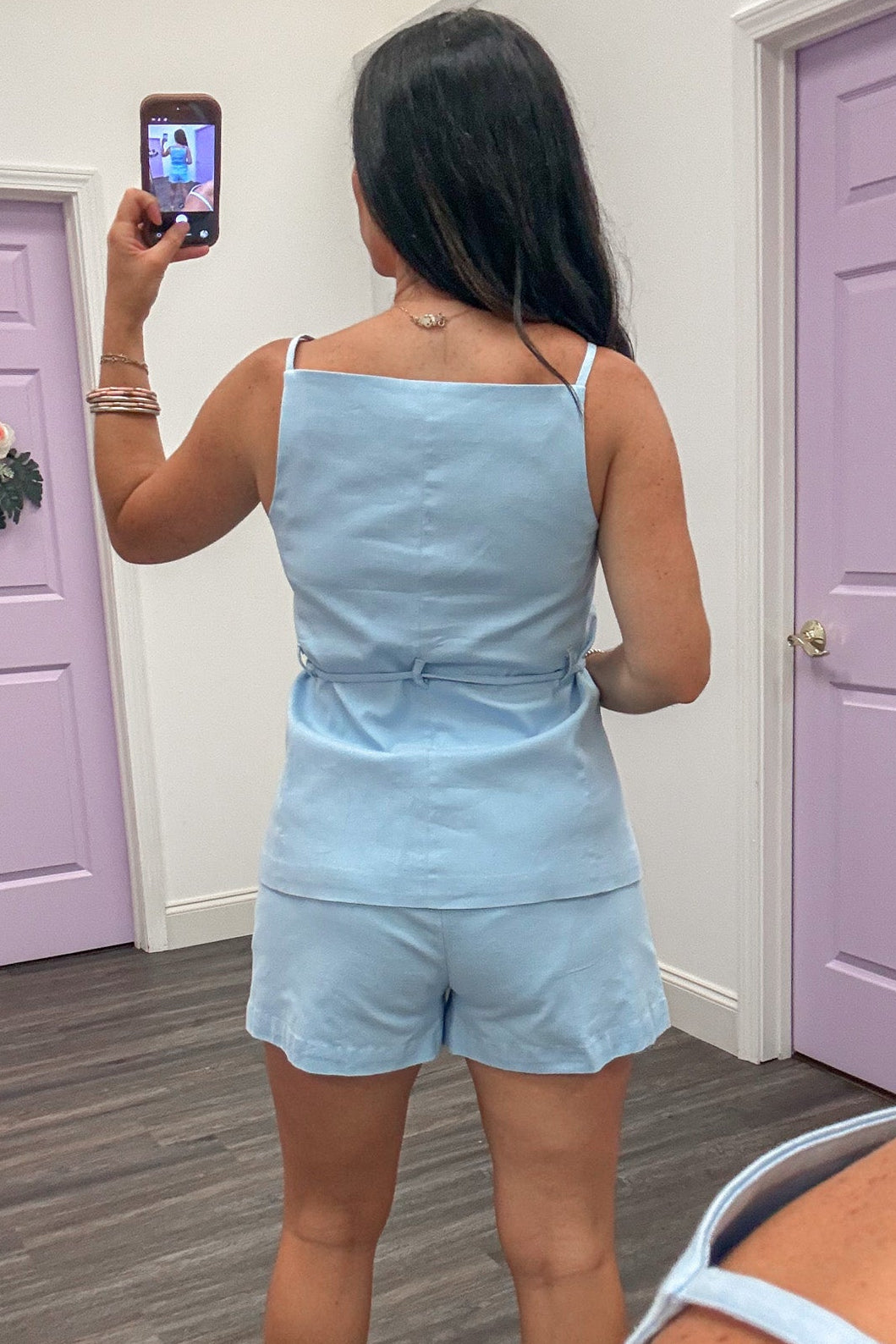 light blue sleeveless square neckline button front belted waist vest style top