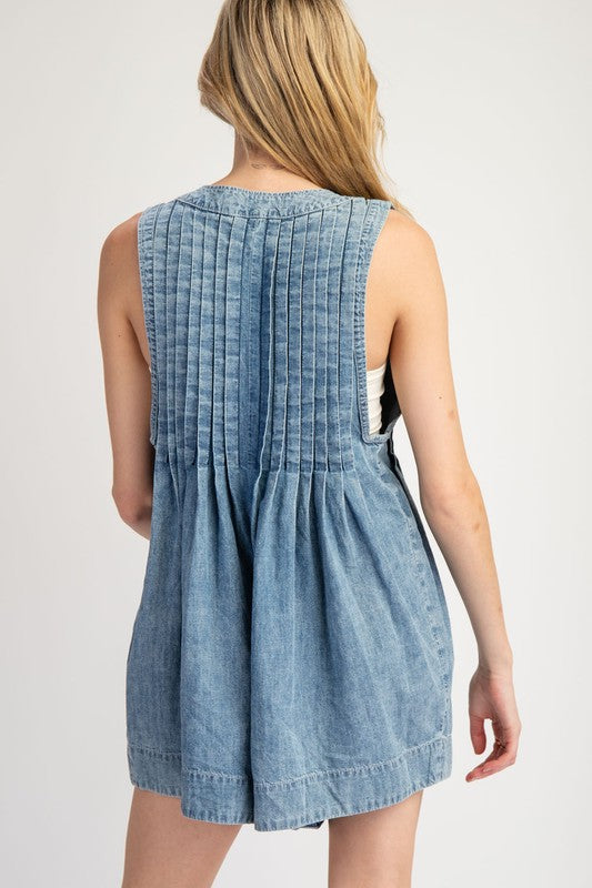 ee:some Washed blue denim sleeveless romper with a ruched bodice and bow tie v neck