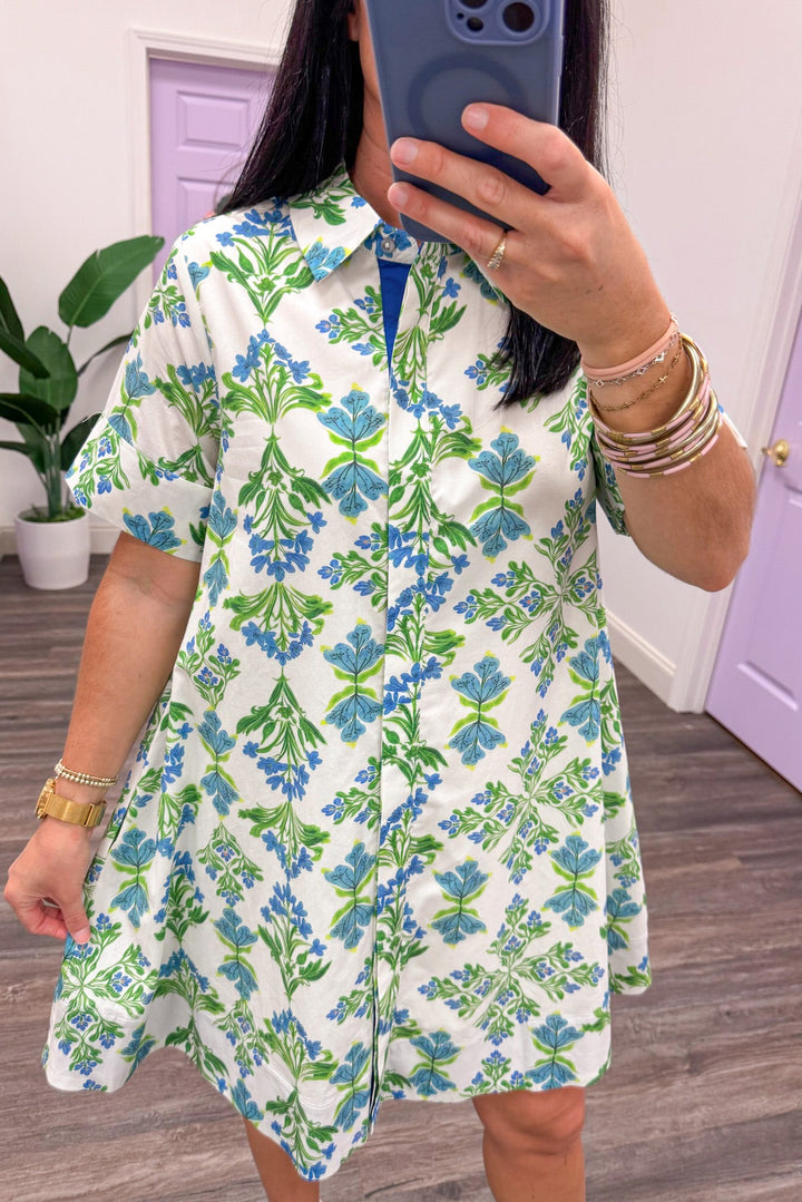 blue and green floral print button front collared neckline cream dress
