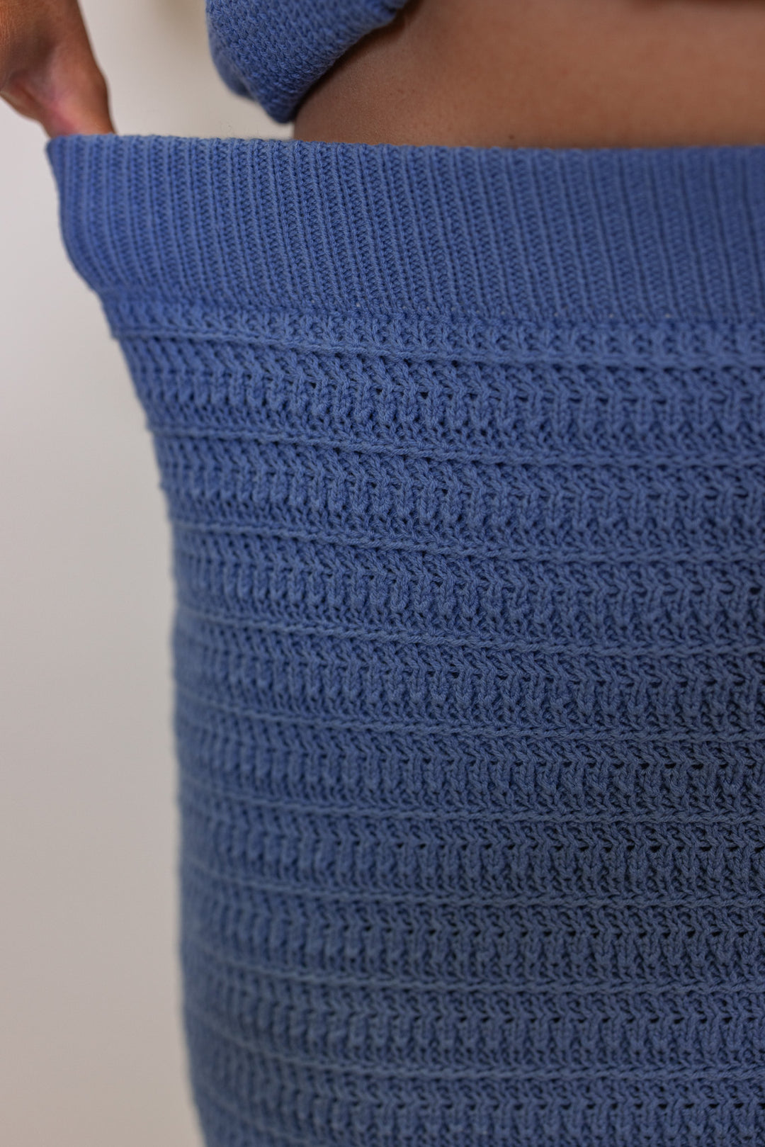 Women's blue sweater knit maxi skirt with matching sleeveless contrasting knit top by Wishlist showing skirts elastic waistband