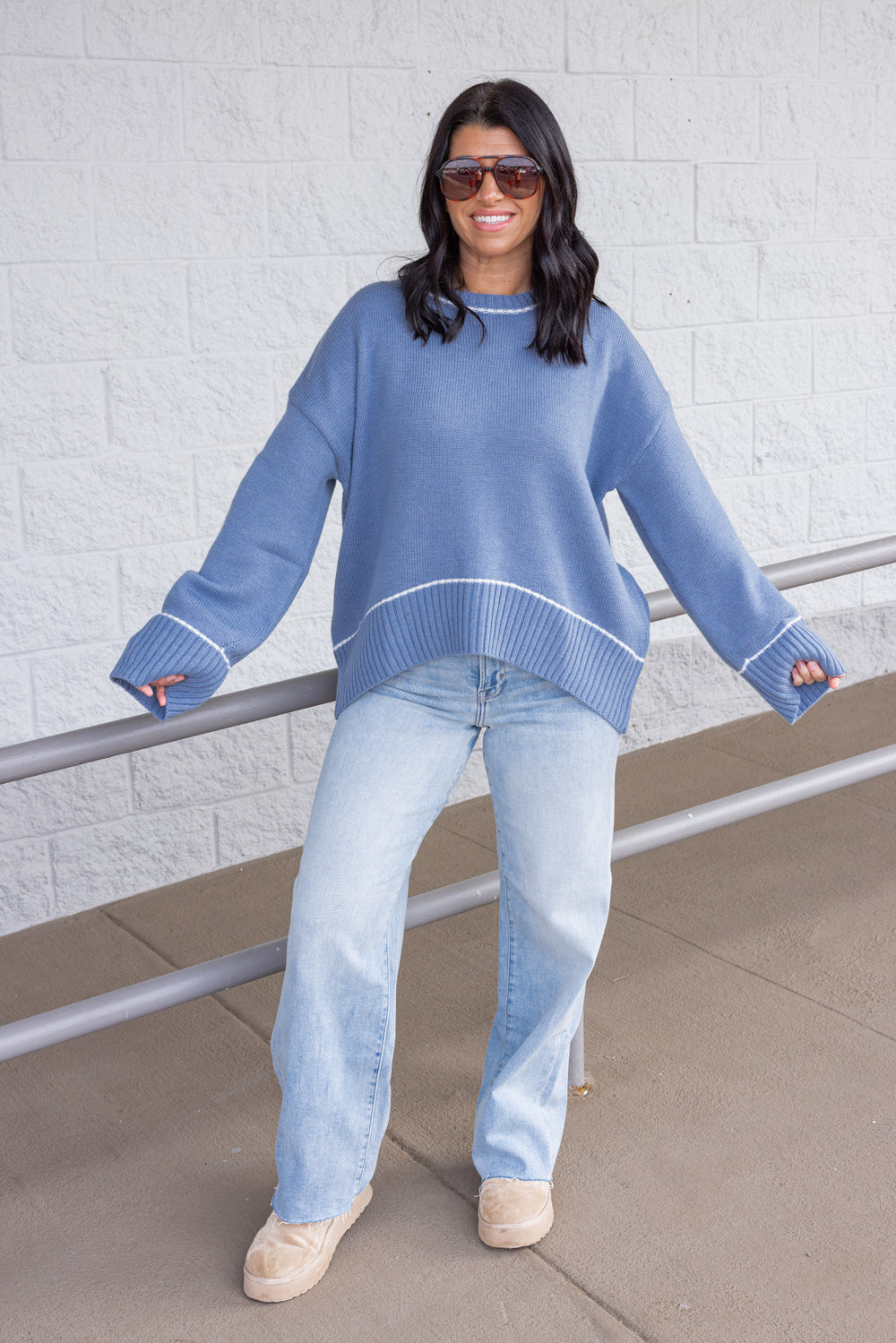 Women's blue knit sweater with cream trim details by Wishlist showing full front view