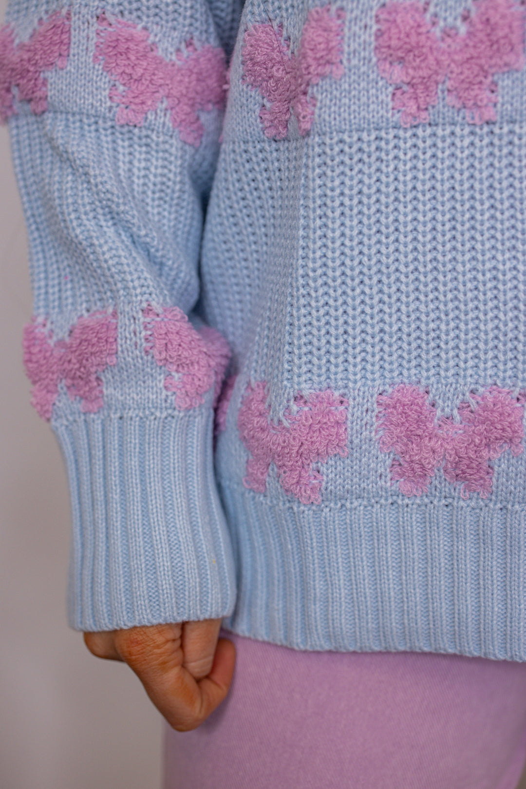 blue pink stitched bow detail sweater