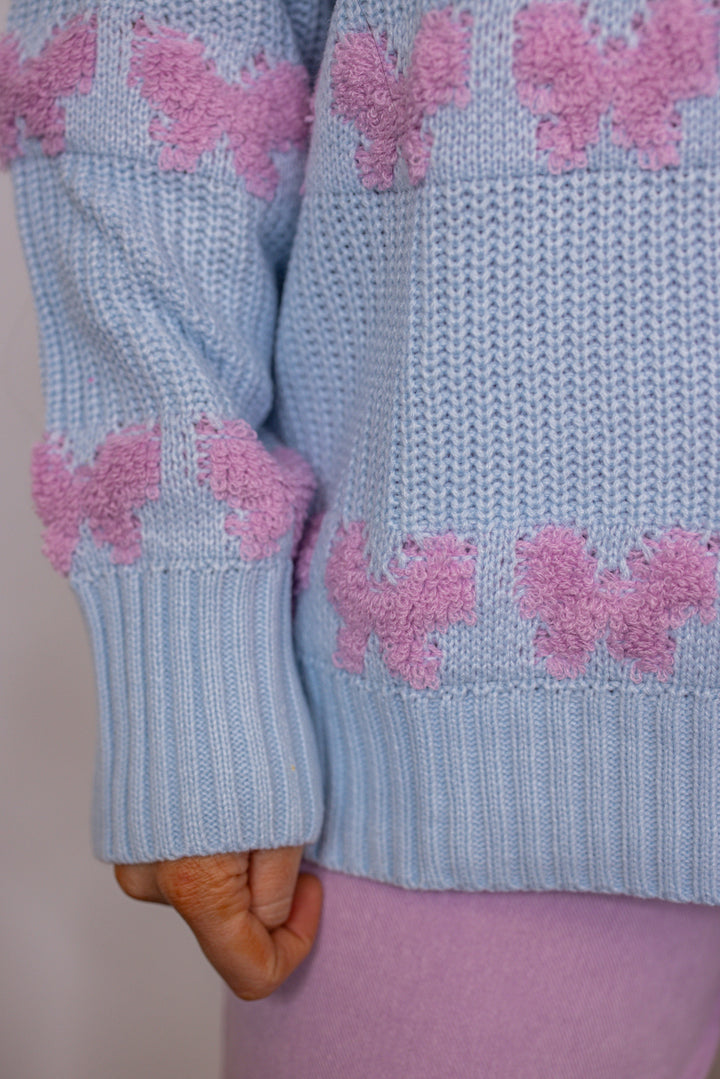 blue pink stitched bow detail sweater