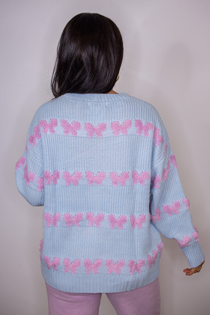 blue pink stitched bow detail sweater
