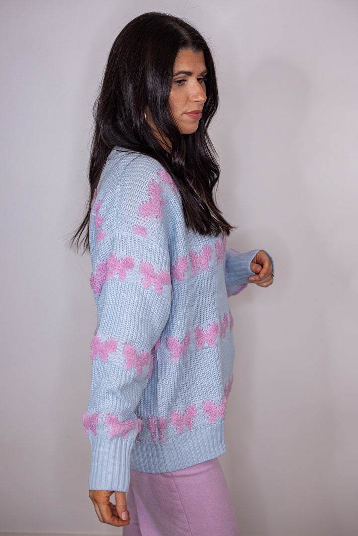 blue pink stitched bow detail sweater