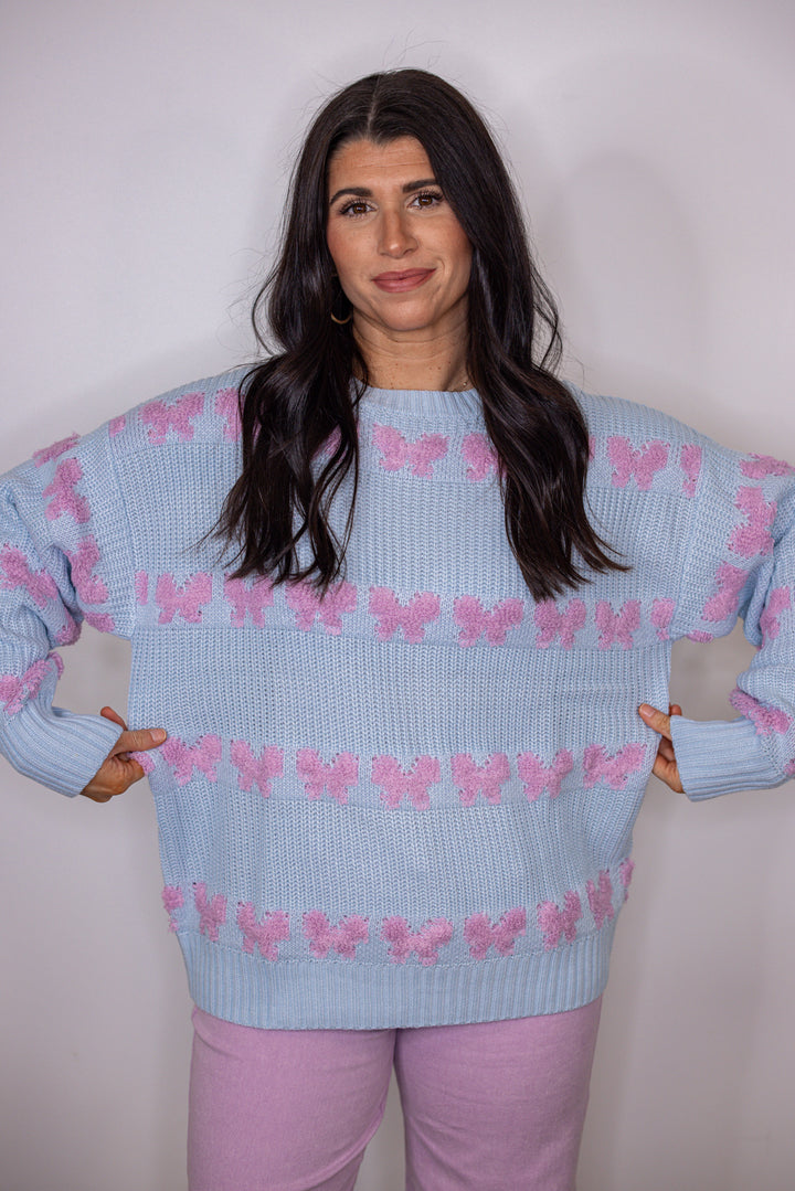 blue pink stitched bow detail sweater