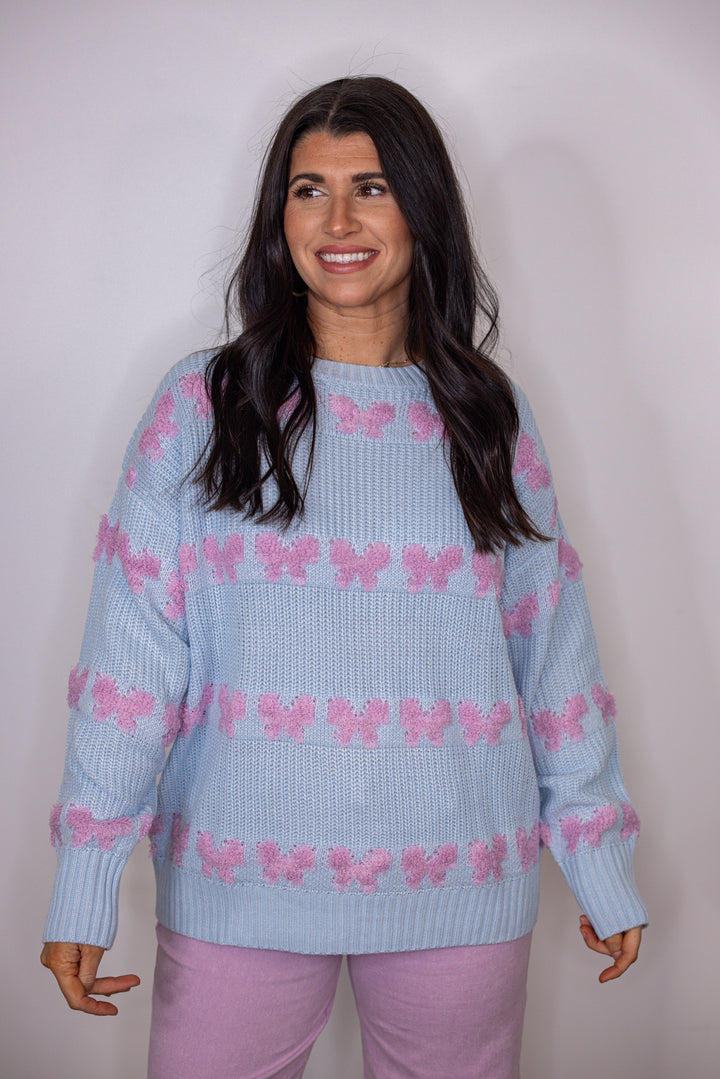 blue pink stitched bow detail sweater
