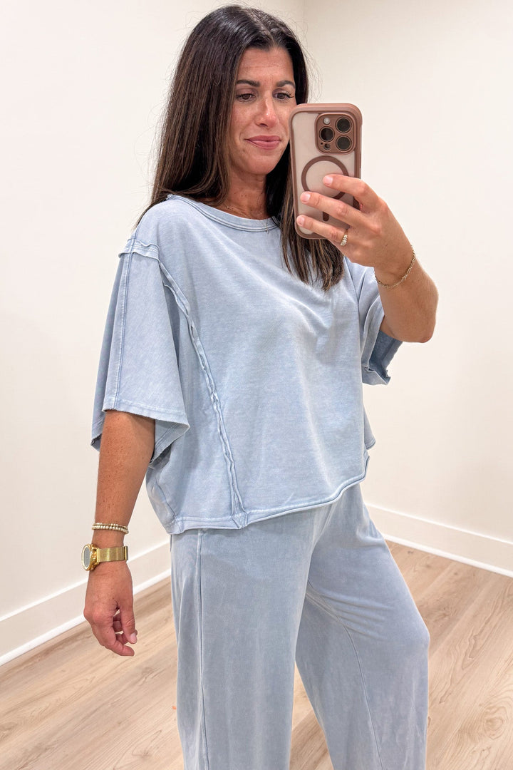 solid light blue drop shoulder short sleeve crew neckline relaxed boxy knit top