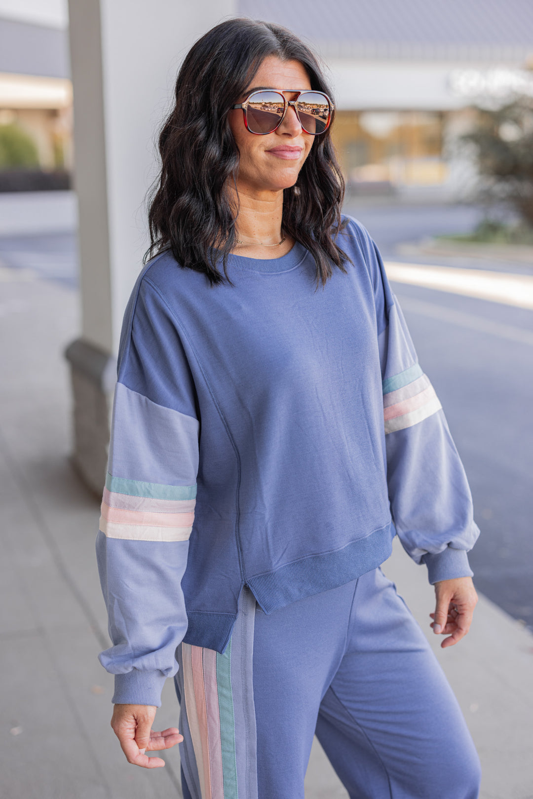 Women's knit top and matching pants set in blue denim shade with stripe trim details by Very J showing up close side view