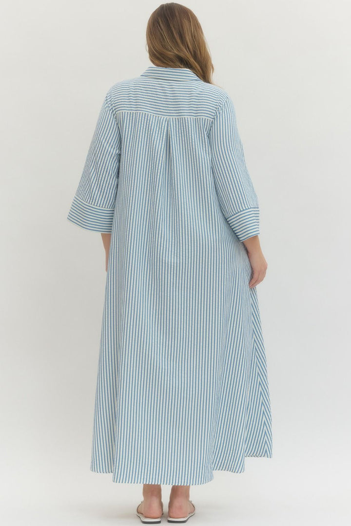 Women's plus size striped blue maxi dress by Entro showing flowy skirt 