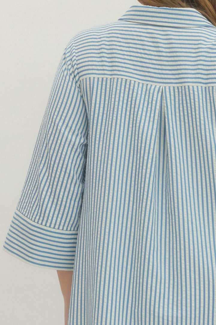 Women's plus size striped blue maxi dress by Entro showing pleated details in back