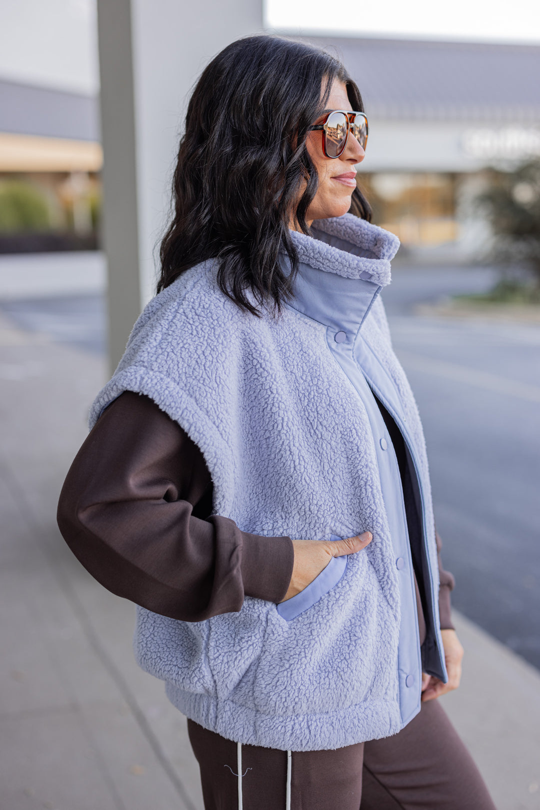 Women's light blue sherpa vest by Rae Mode showing side view