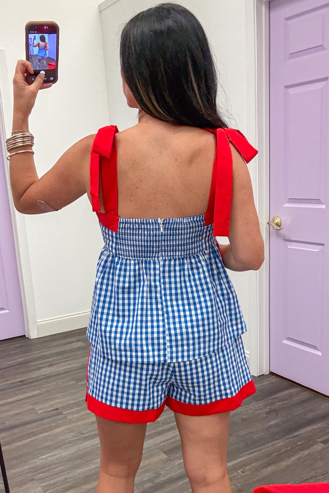 blue and white gingham with red self tie shoulder straps peplum top