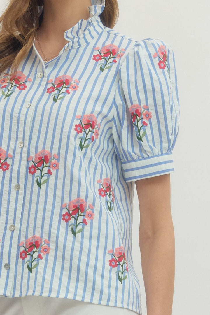 Entro blue and white striped button front top with pink and red embroidered flowers and puff sleeves